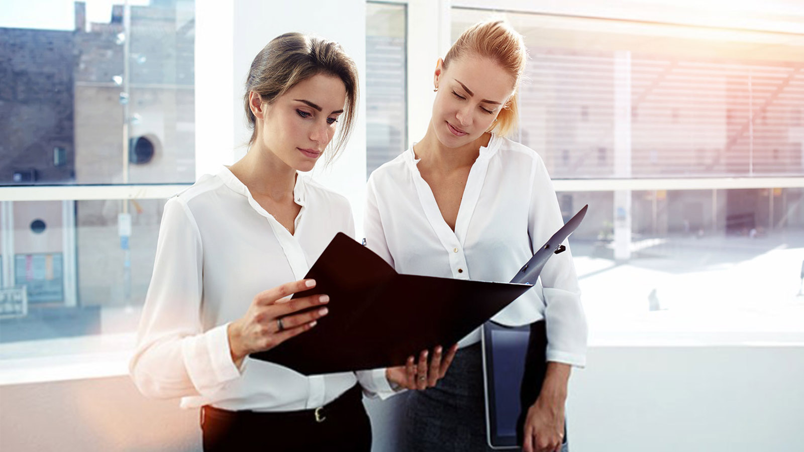 two_woman_looking_at_a_file